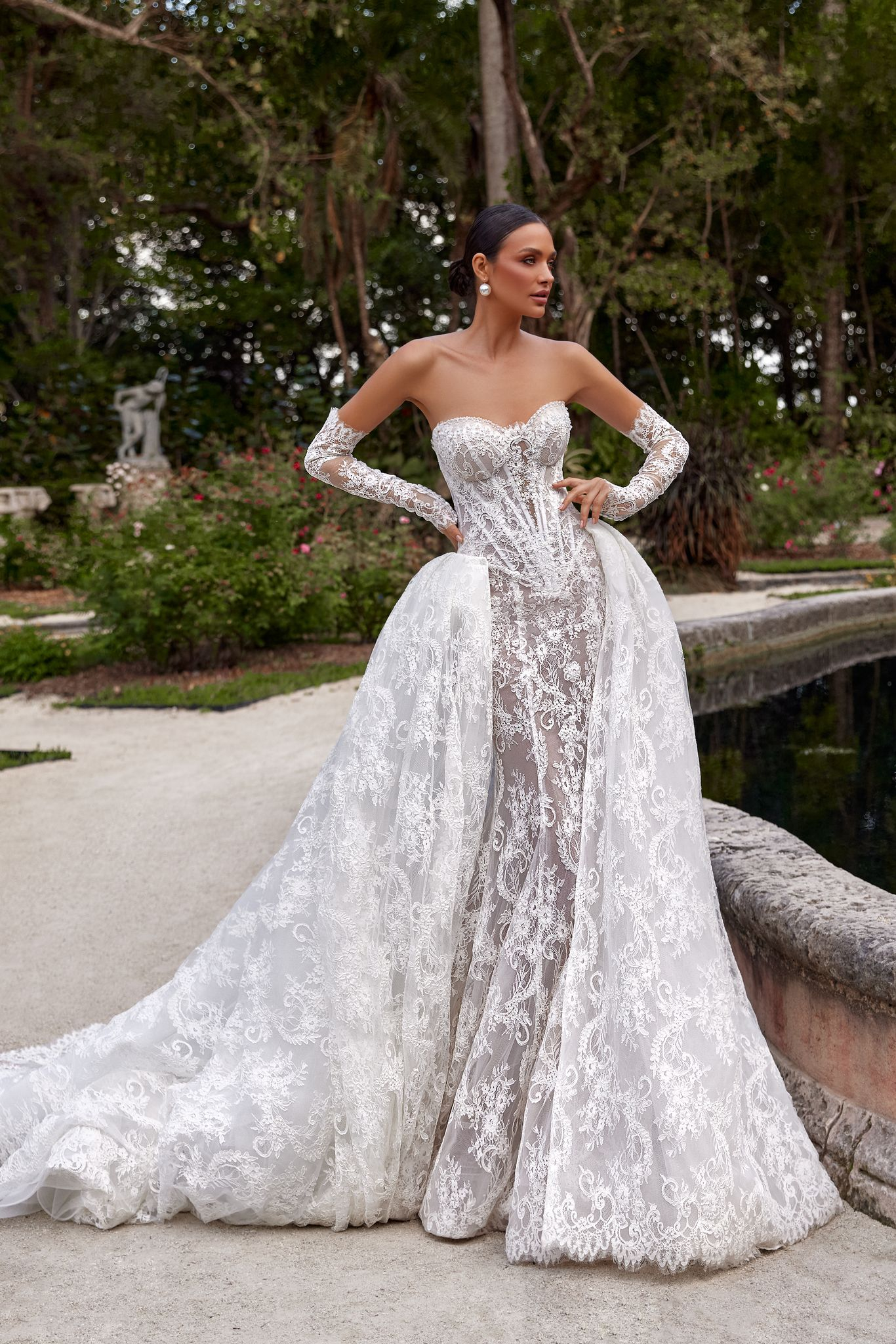 wedding dress Bella by OKSANA MUKHA Wedding dress: extended corset, sheer lace, hand-placed pearls, and detachable train