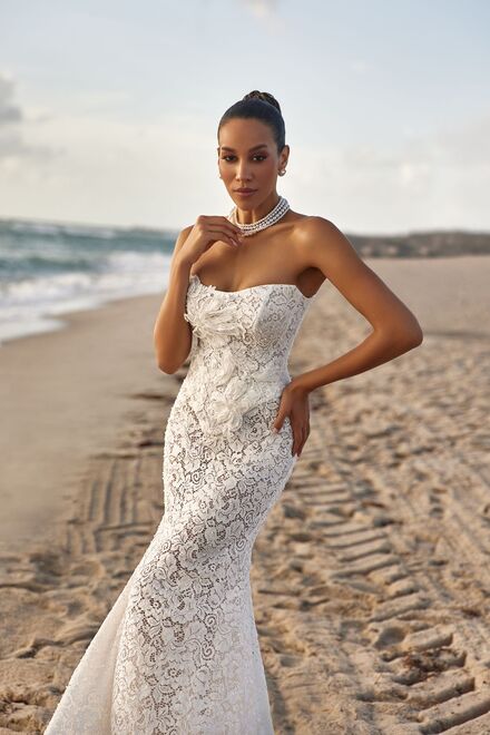 wedding dress Iris by OKSANA MUKHA Contemporary Iris bridal gown with sheer hand-embroidered lace and floral appliqués.