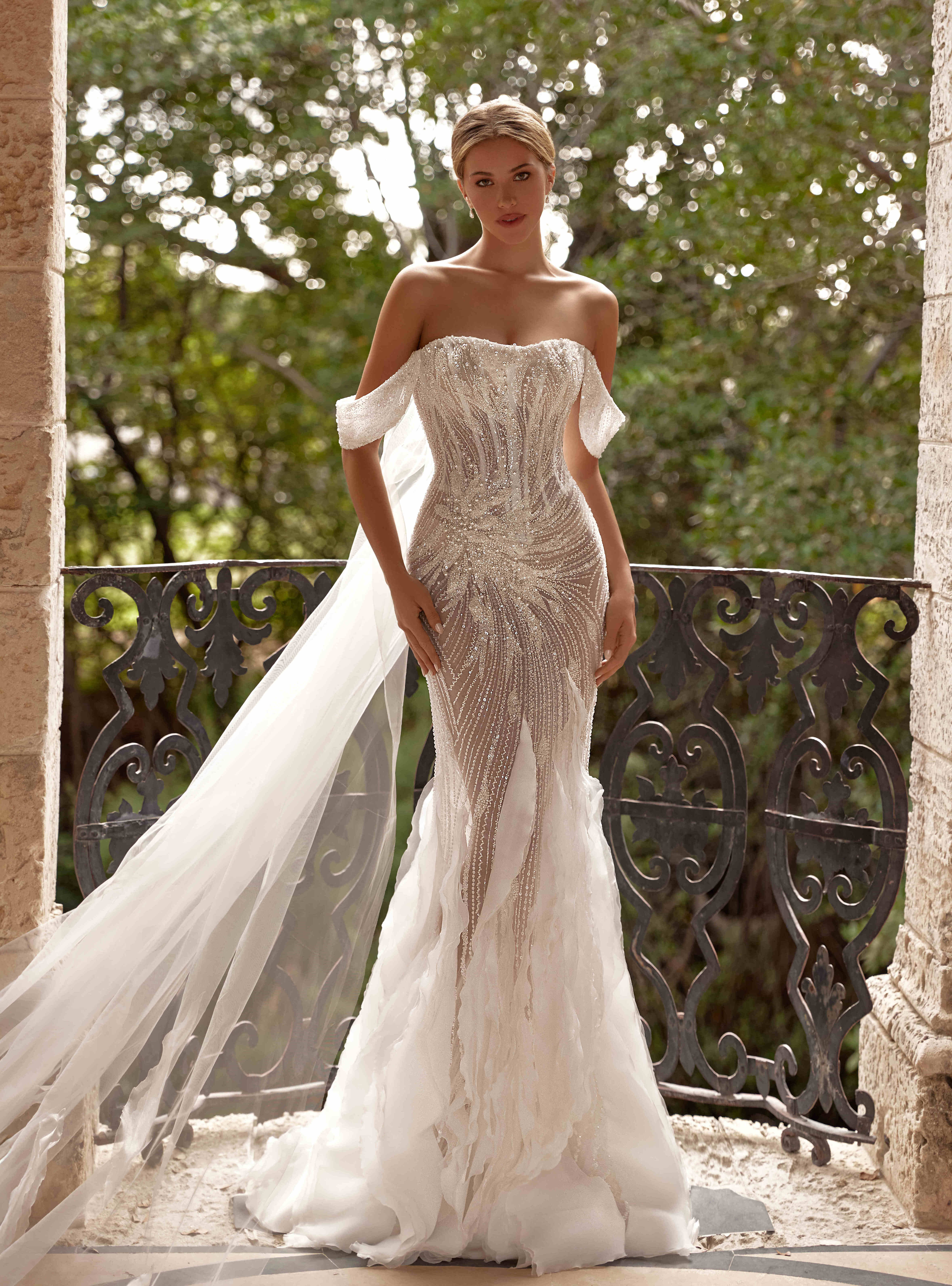 wedding dress Rafaele with cape by OKSANA MUKHA Rafaele bridal gown: fitted corset with semi-sheer fabrics and shimmering embroidery