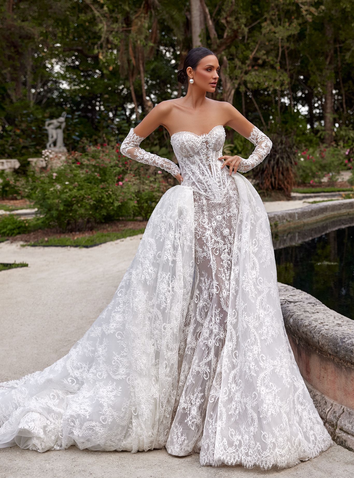 wedding dress Bella by OKSANA MUKHA Wedding dress: extended corset, sheer lace, hand-placed pearls, and detachable train
